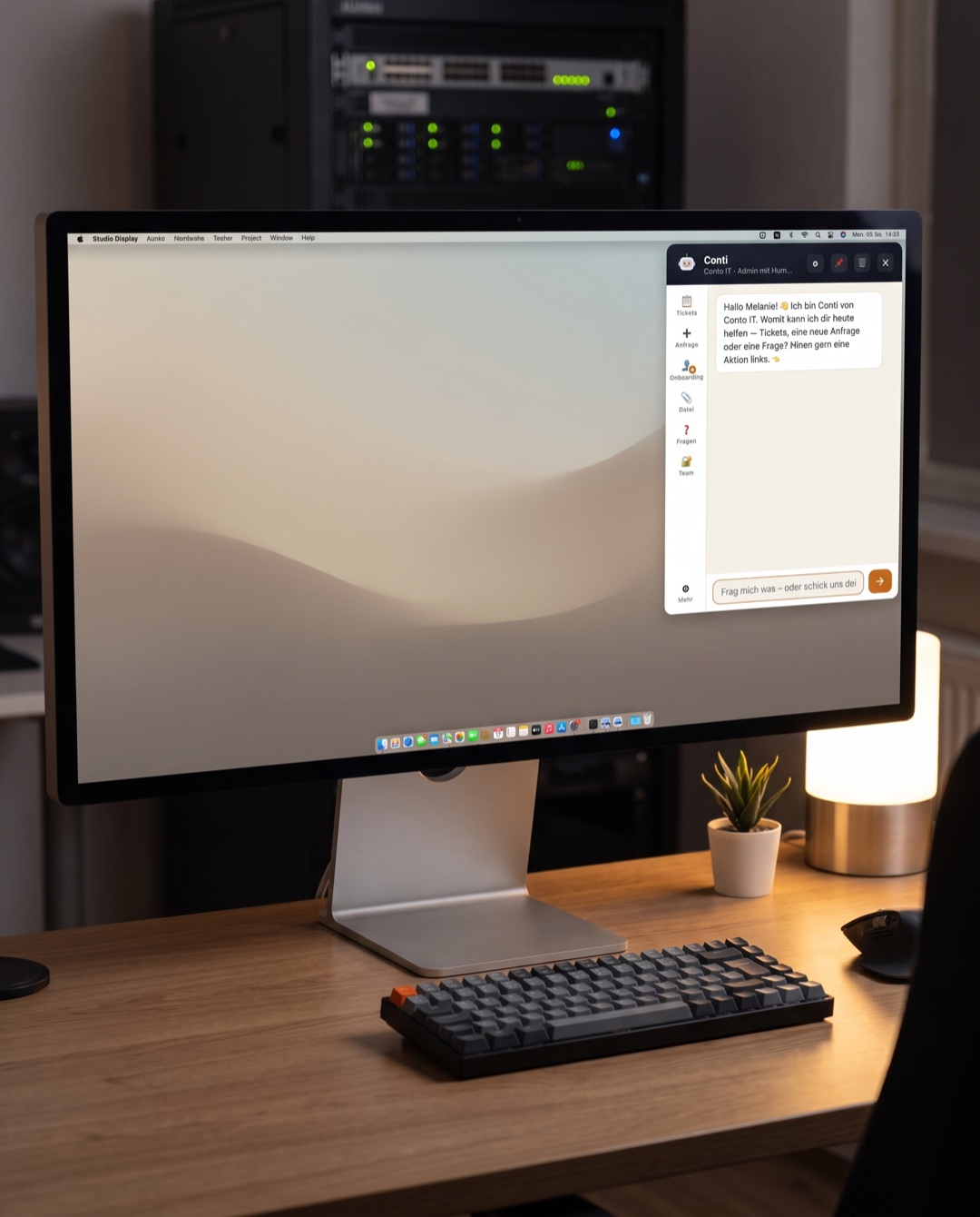 Conti chat window on a Mac desktop in a modern IT service company